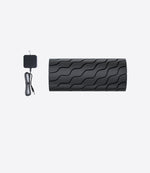 Load image into Gallery viewer, Therabody Wave Roller laid out beside its charging cable on a white background