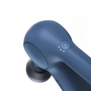close up of the power button on the Therabody Theragun Relief in navy 