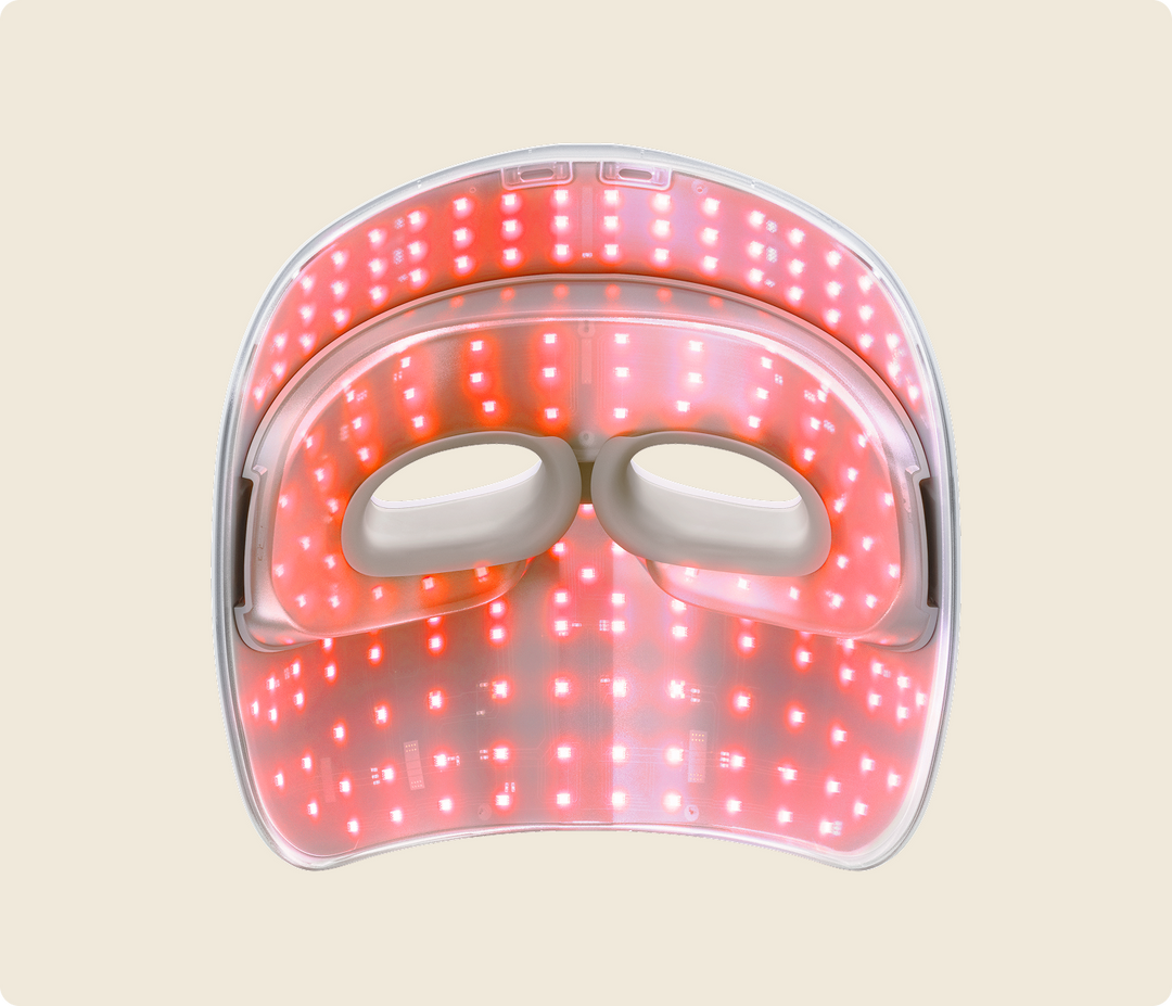Back view of Therabody Theraface Mask Glo with red light therapy activated