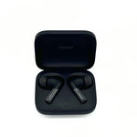 Load image into Gallery viewer, Comply True Grip Memory Foam Ear Tips on black earphones in black earphone casing