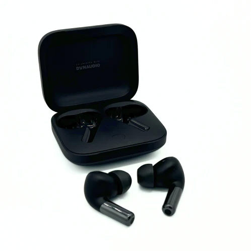 Comply True Grip Memory Foam Ear Tips on black earphones in front of black earphone casing