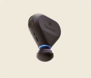 Therabody Theragun Mini Plus with the heat attachment, set to maximum speed and medium heat level floating