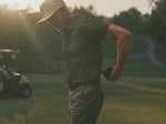 Load and play video in Gallery viewer, Man uses black Therabody Theragun Mini 3 on various parts of his body on a golf course