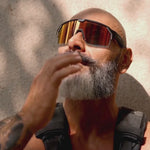 Load and play video in Gallery viewer, video of various men changing the tint levels on the Chamelo Music Shield they are wearing