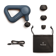Therabody Theragun Relief in navy accompanied by its carry case, charging cable and 3 attachments