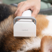 someone combing their dog while using the Neabot P1 PRO Deshedding Brush Attachment