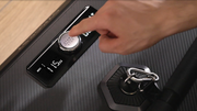 person pressing the power button on STRONGether PowerStation
